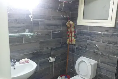 a bathroom with a toilet and a sink at 201Sheraton Plaza in Hurghada