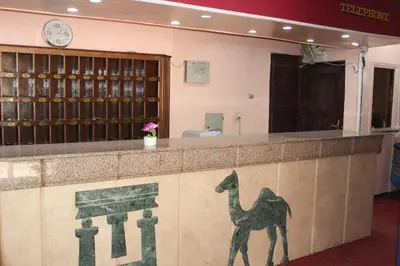 a bar with a painting of a camel on it at Tiba Hotel in Aswan