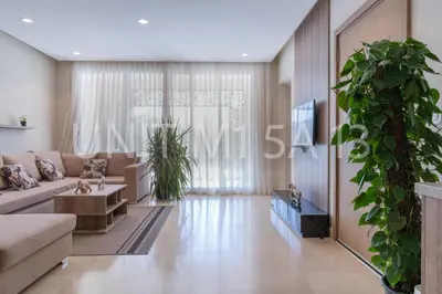 a living room with a couch and a plant at Elgouna Heart Mangroovy new 2bedrooms in Hurghada