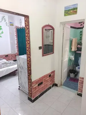 a mirror on a wall in a room with a bathroom at Four Seasons Hotel in Hurghada