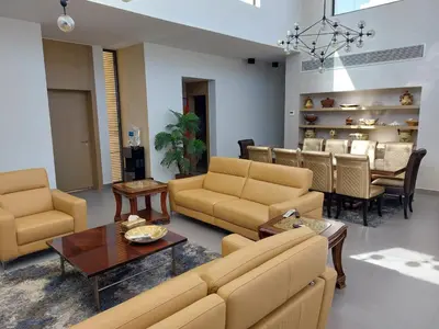 a living room with a couch and chairs and a table at El Gouna luxe in Hurghada