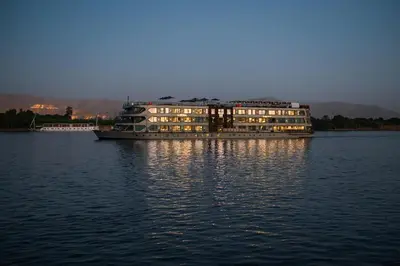 a large building in the middle of the water at Historia The Boutique Hotel Nile Cruise - Every Monday from Luxor for 04 & 07 Nights - Every Friday From Aswan for 03 & 07 Nights in Luxor