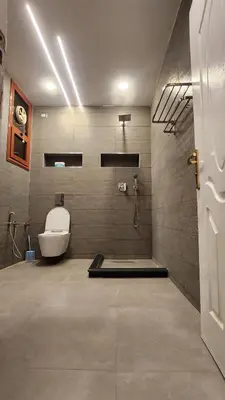 a bathroom with a toilet and a shower at Kemet Apartment luxor in Luxor
