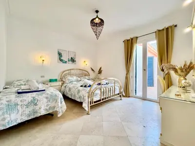 a bedroom with two beds and a window at Hill Villa Venezia El Gouna: pool, beach & WiFi in Hurghada
