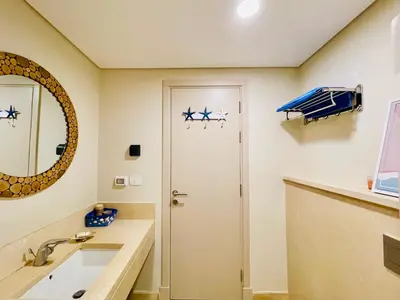 a bathroom with a door with stars on it at Kitesurfer Shared House, Pool View & Beach Access in Hurghada