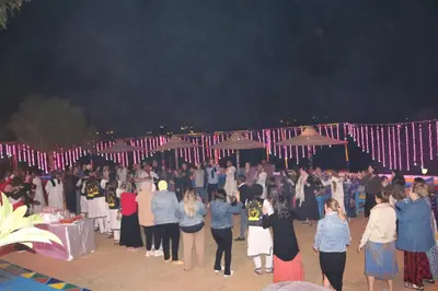 a group of people standing in front of a crowd at Artika Wadi Kiki Hotel in Aswan