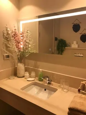 a bathroom with a sink and a large mirror at Jutta Deluxe 2,5-Bedroom-Apartment Mangroovy-M10 El Gouna in Hurghada