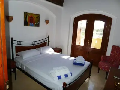 a bedroom with a bed with two towels on it at Gorgeous Villa in Gouna with Heated Private Pool in Hurghada