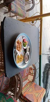 a bowl of food sitting on top of a chair at Mostafa Jamaica guesthouse in Aswan