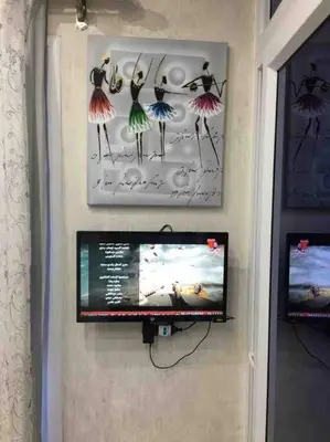 a flat screen tv hanging on a wall at Oasis resort-Nice Condo -B31-Al Ahyaa - Hurghada in Hurghada