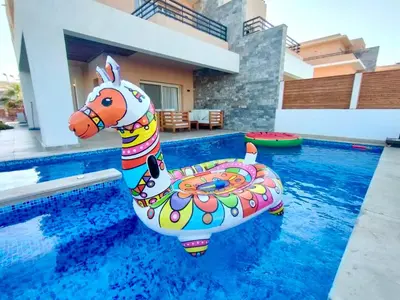 a inflatable unicorn in a swimming pool at Hurghada Sahl Hasheesh sea-view Villa with private pool in Hurghada
