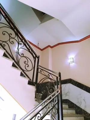 a staircase with a wrought iron railing in a house at Studio pool view next to the Marina,Sheraton Plaza 320 in Hurghada
