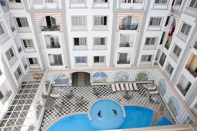 an overhead view of a building with a pool at Studio pool view next to the Marina,Sheraton Plaza 320 in Hurghada