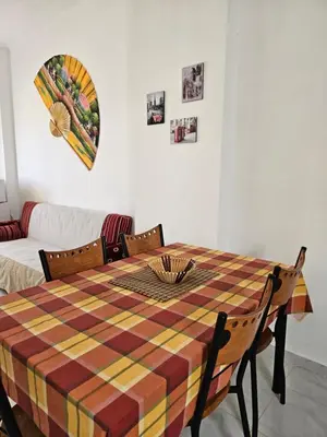 a dining room table with a colorful checkered table cloth at Hurghada Village sea view in Hurghada