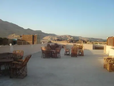 a group of chairs and tables on a patio at Rose Guest House \u60a8\u5728\u76e7\u514b\u7d22\u7684\u7b2c\u4e8c\u500b\u5bb6 in Luxor