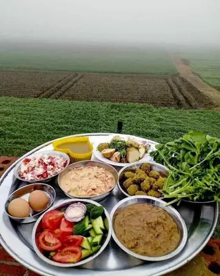 a tray filled with different types of food on a table at Nubia castle in Aswan