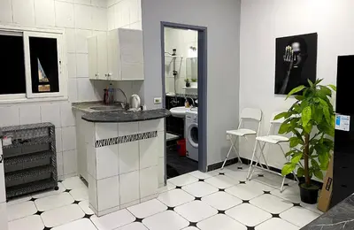 a kitchen with a sink and a counter top at Lima Modern. Sea View. Strong Wi Fi. Sheraton Road in Hurghada