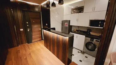 a kitchen with a washer and dryer in a room at Sphinx Luxor Apartment in Luxor