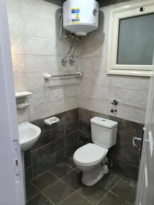 a bathroom with a toilet and a sink at sheraton blaza307 in Hurghada