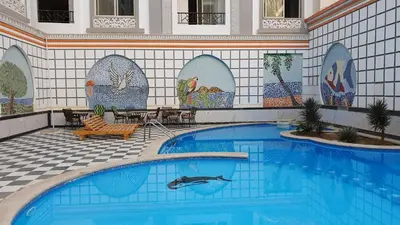 a swimming pool with a dolphin in the middle at sheraton blaza307 in Hurghada