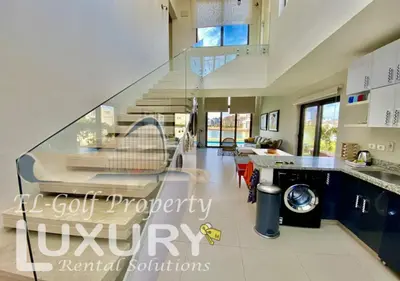 a kitchen with a staircase in a house at Tawila Villa T1-15 in Hurghada