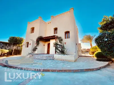 a house with a tennis racket in front of it at Private Villa Y51 - 3 BedRooms at El-Gouna in Hurghada