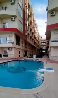 a large swimming pool in front of a building at Casablanca Beach Hurgada in Hurghada