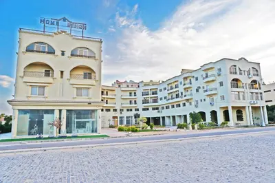 a large white building on the side of a street at Modern Mountain View on The Touristic Promenade in Hurghada