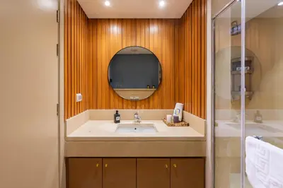 a bathroom with a sink and a mirror at Elegant & Edgy 2 BR w Beach & Pool Mangroovy in Hurghada
