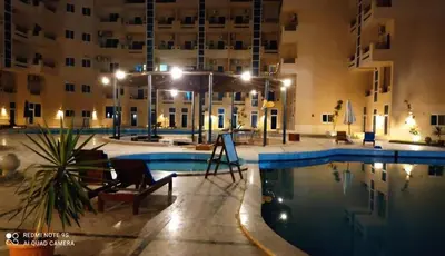 a swimming pool in a hotel at night at Tiba Resort F22 Near to ElGouna in Hurghada