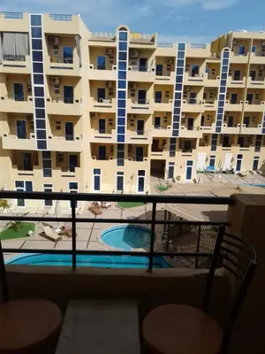 a view of a large apartment building from a balcony at Tiba Resort F22 Near to ElGouna in Hurghada