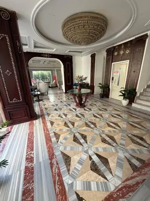 a lobby with a tile floor and a ceiling at La Boutique Residence in Hurghada