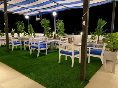a group of tables and chairs under a tent at La Boutique Residence in Hurghada