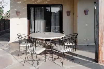 a table and chairs sitting on a patio at Modern Villa in El Gouna (Private Pool & Garden.) in Hurghada