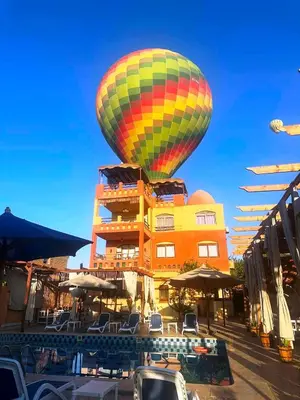 a hot air balloon in front of a building at Nile Compound in Luxor