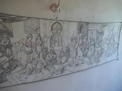 a tapestry hanging on a wall with a painting at Nour El Balad in Luxor