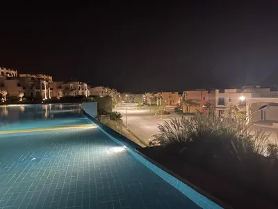 a view of a swimming pool at night at Villa for you on your own in Makadi Heights, Hurghada, Read Sea, Egypt in Hurghada