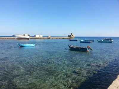 a group of boats sitting in the water at Sun & Fun in Quseir