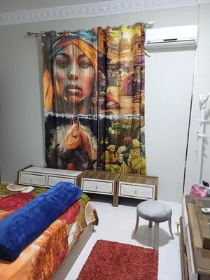 a bedroom with a mural of a woman with a horse at Sun & Fun in Quseir