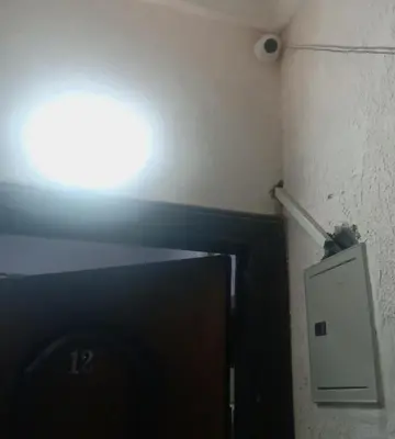a light on the corner of a room with a tv at Yasin - Enjoy the privacy of staying in a quiet apartment with free Wi-Fi as your complete second home in the heart of Hurghada in Hurghada