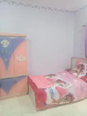a childs bedroom with a bed with a barbietheme at Yasin - Enjoy the privacy of staying in a quiet apartment with free Wi-Fi as your complete second home in the heart of Hurghada in Hurghada