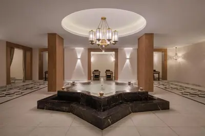 a large lobby with a large fountain in the middle at Xanadu Makadi Bay - High Class All Inclusive in Hurghada