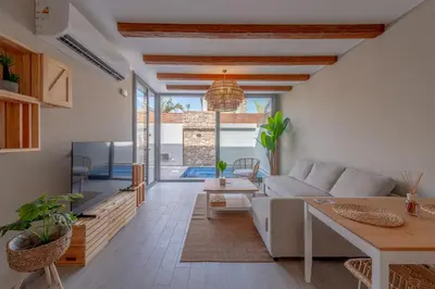 a living room with a couch and a table at Modern 1 Bedroom Apartment Bali El Gouna Private Patio & Heated Pool in Hurghada