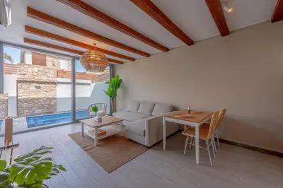 a living room with a couch and a table at Modern 1 Bedroom Apartment Bali El Gouna Private Patio & Heated Pool in Hurghada