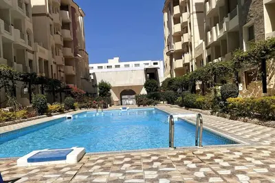 a swimming pool in the middle of a building at Florenza Khamsin - sea view / free Wi-Fi in Hurghada