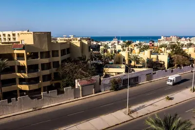 a view of a city with a road and buildings at Florenza Khamsin - sea view / free Wi-Fi in Hurghada
