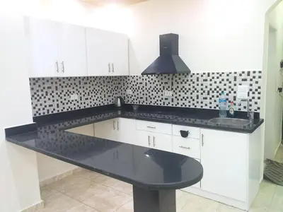 a kitchen with a black counter and a sink at sheraton 212 in Hurghada