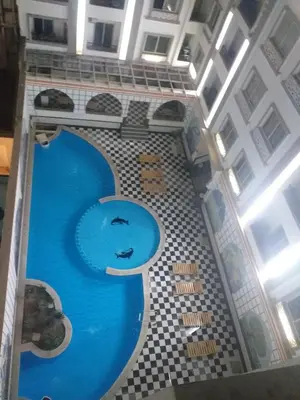 a swimming pool in the middle of a building at sheraton 212 in Hurghada