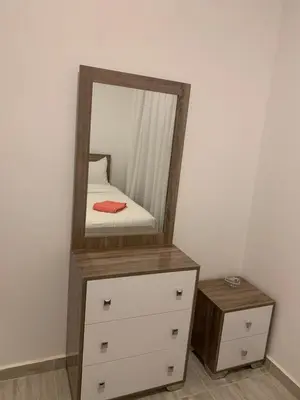a mirror on top of a dresser with a drawer at Aqua Palms Resort by Ivan C408 in Hurghada