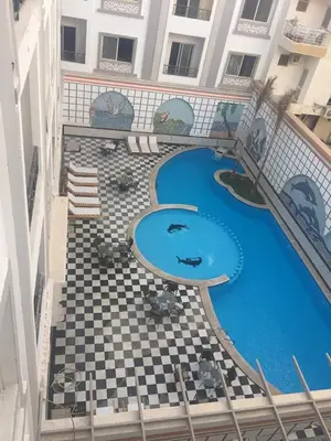 an overhead view of a swimming pool in a building at sheraton blaza329 in Hurghada